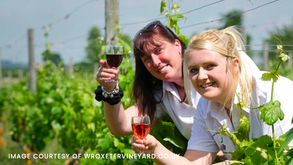 Wroexter vineyard - two ladies with a glass of vine.